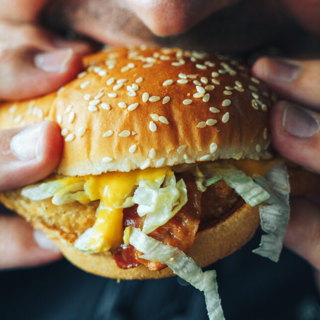 nutrition, chowing down on a cheeseburger