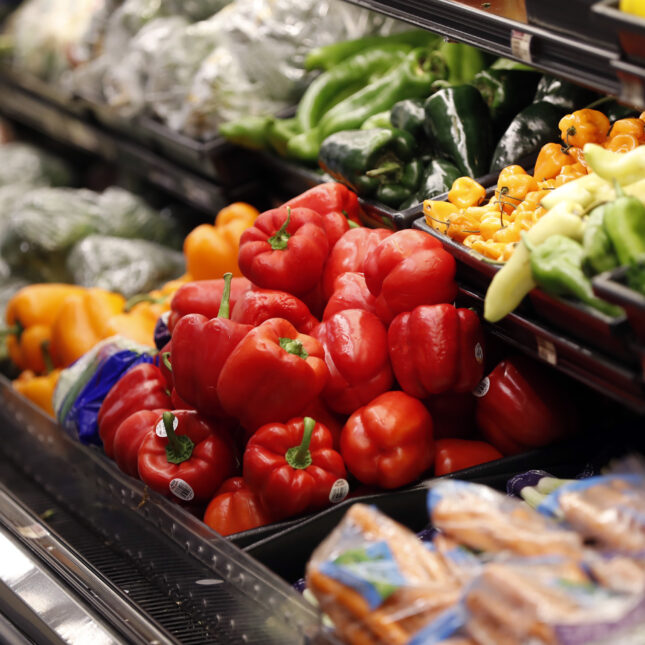 Red peppers were displayed on a grocery fridge along with other peppers and baby carrots — first opinion coverage from STAT